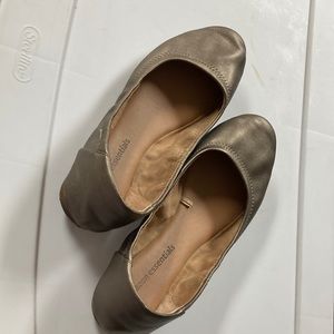 Bronze colored slip on flats.